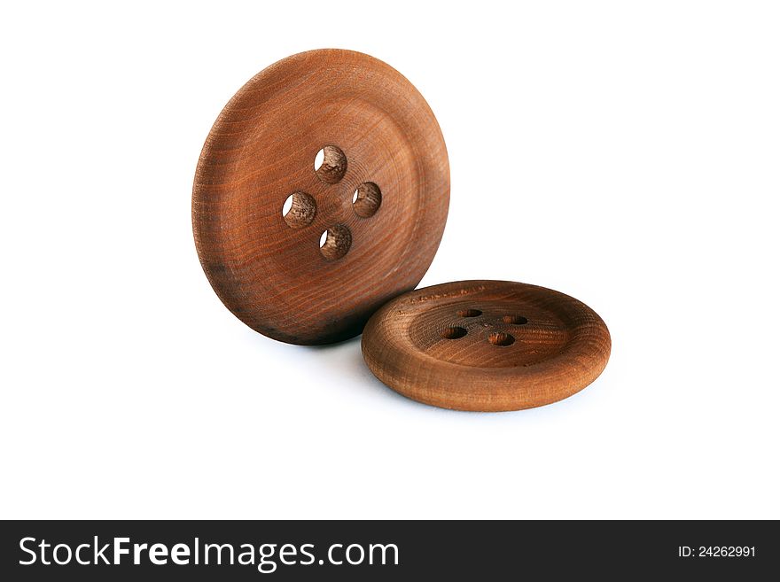 Two brown wooden buttons on white background. Isolated with clipping path