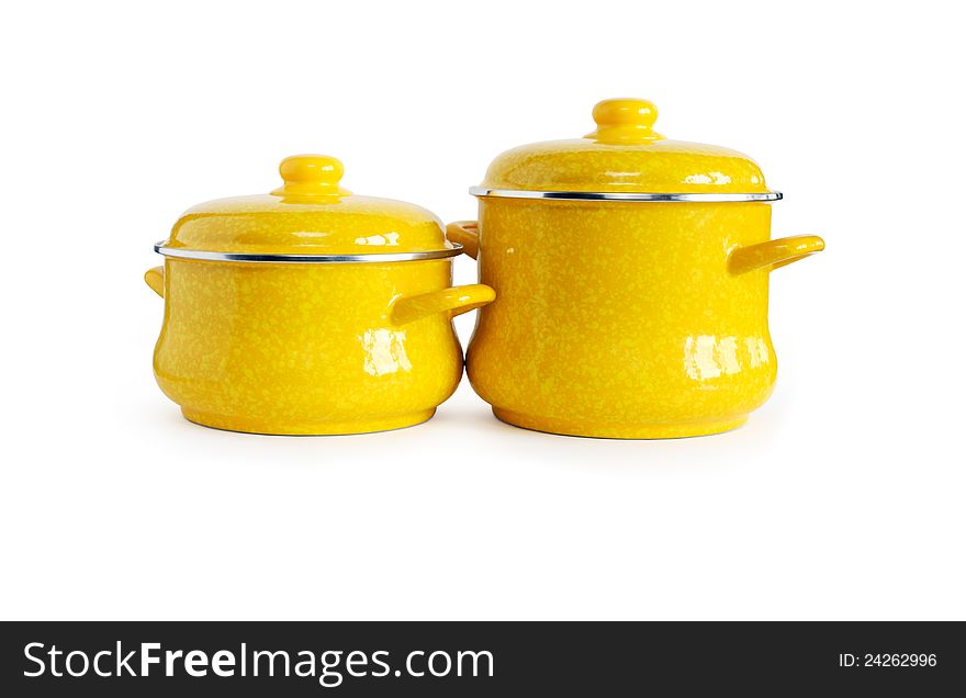 Two new yellow saucepans on white background. Clipping path is included