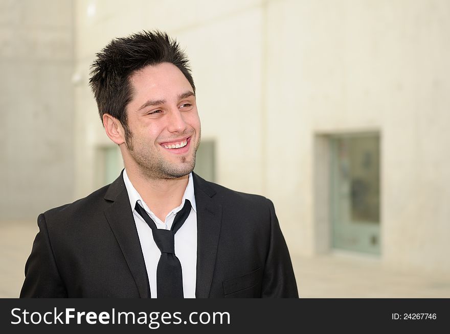 Handsome young businessman smiling