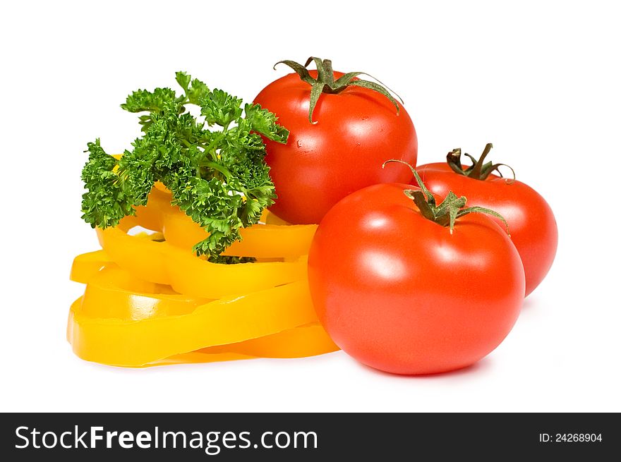 Tomatoes, peppers and parsley on a white background