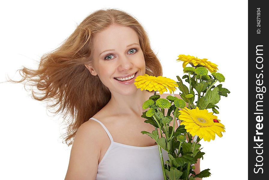 Beautiful smiling girl with flowing hair holding a bouquet of yellow flowers gerbera isolated on white background. Beautiful smiling girl with flowing hair holding a bouquet of yellow flowers gerbera isolated on white background