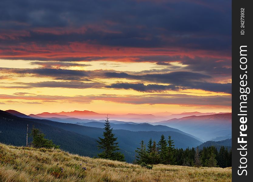 Landscape in the mountains with a cloudy sky colors the sunset. Ukraine, the Carpathian mountains. Landscape in the mountains with a cloudy sky colors the sunset. Ukraine, the Carpathian mountains