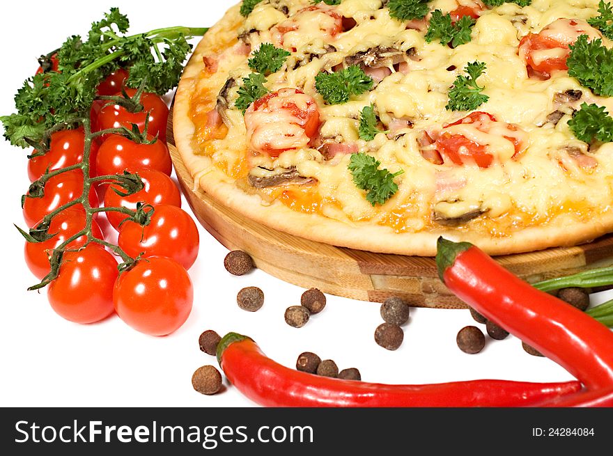 Pizza, cherry tomatoes and chili peppers on white background