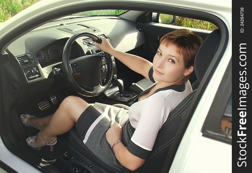 Portrait of happy woman in car