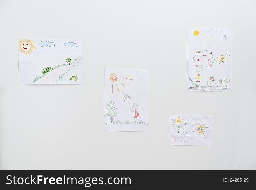 Collection of children's drawings on the wall. Collection of children's drawings on the wall