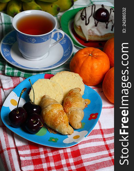 Assortment of cakes and fruit for teatime. Assortment of cakes and fruit for teatime