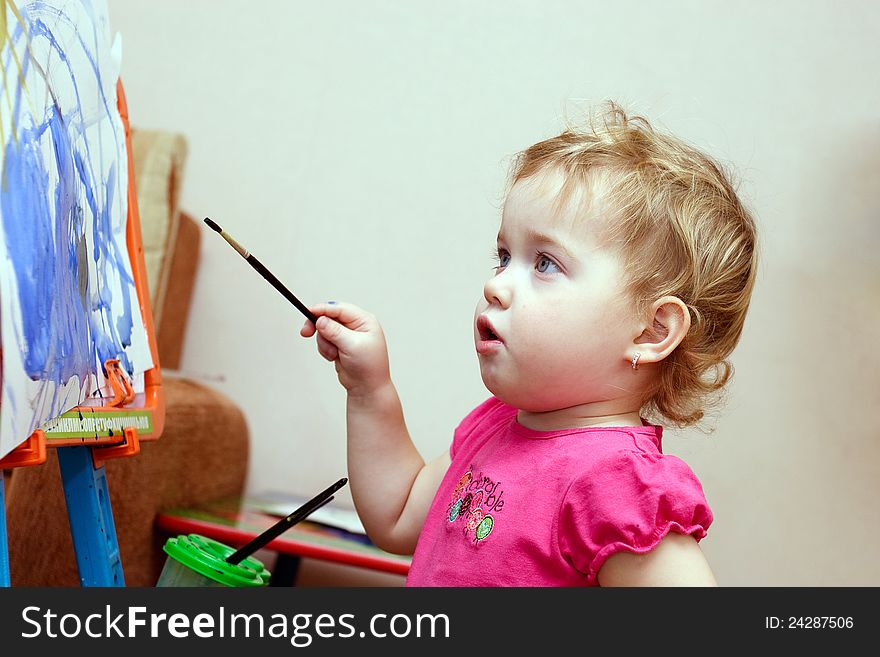 Adorable little girl drawing artwork. Adorable little girl drawing artwork