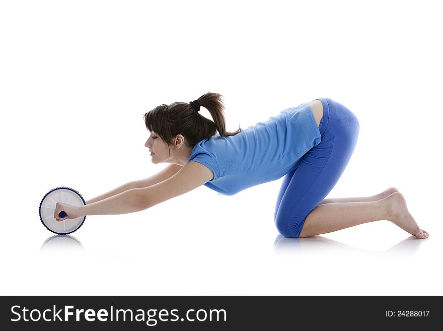 Girl with a gymnastic roller on  white background