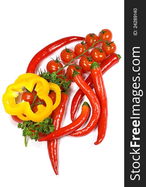 Peppers , cherry tomatoes and parsley on a white background