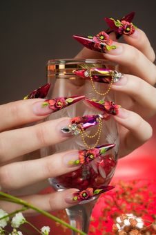 Manicure Of Beautiful Hands With A Glass Royalty Free Stock Photography