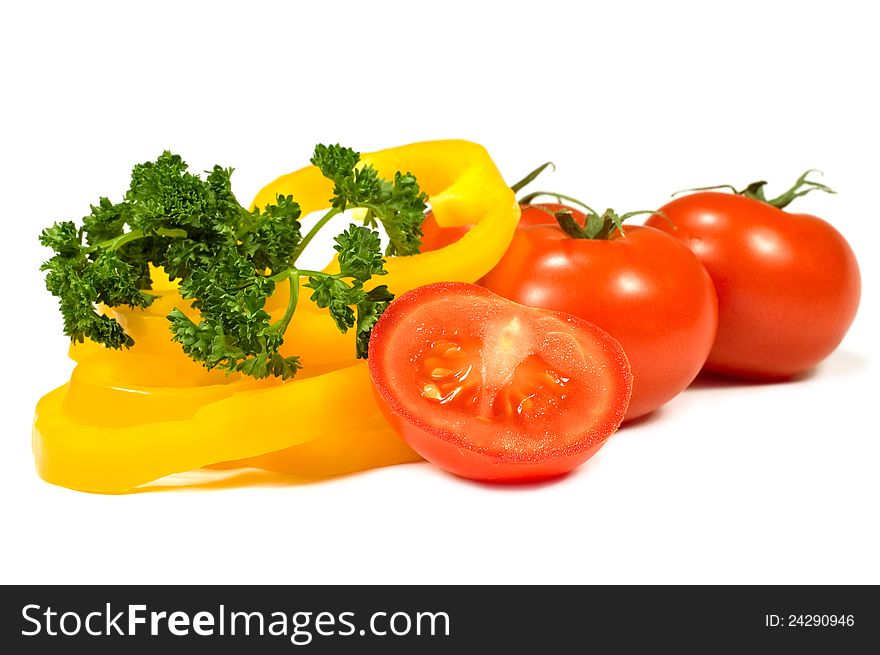 Tomatoes, peppers and parsley on a white background