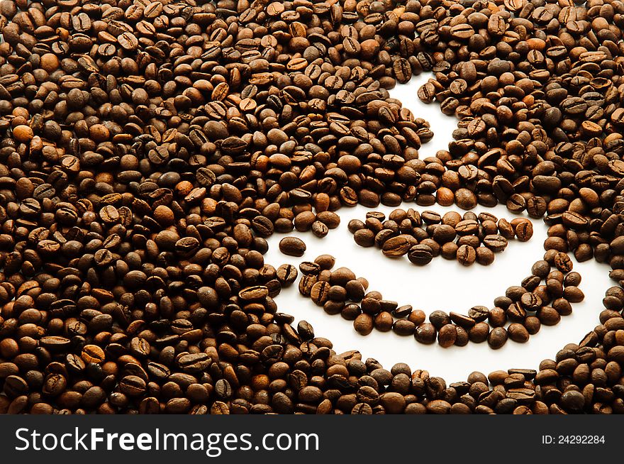 Background with coffee beans with a coffee cup drawing and space for text. Background with coffee beans with a coffee cup drawing and space for text
