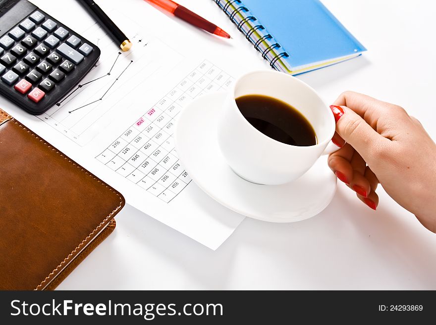 Female officer holding white coffee cup during working time at office. Female officer holding white coffee cup during working time at office.