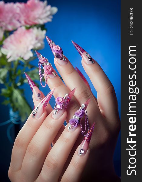 Beautiful manicure of nails, hands hold a beautiful flower. Beautiful manicure of nails, hands hold a beautiful flower
