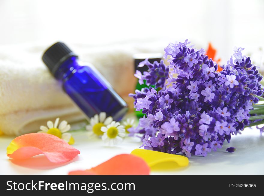 Essential oil with herbal flowers. Essential oil with herbal flowers