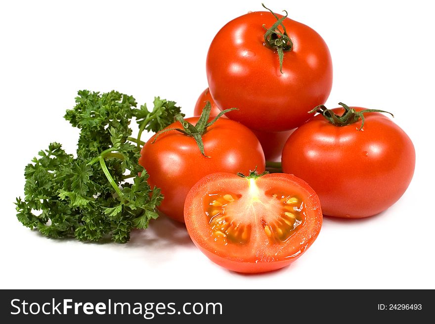 Tomatoes with parsley on a white background