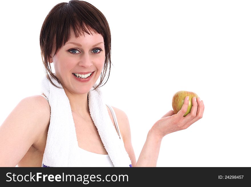 Image of a young woman in the gym after workout just about to eat an apple