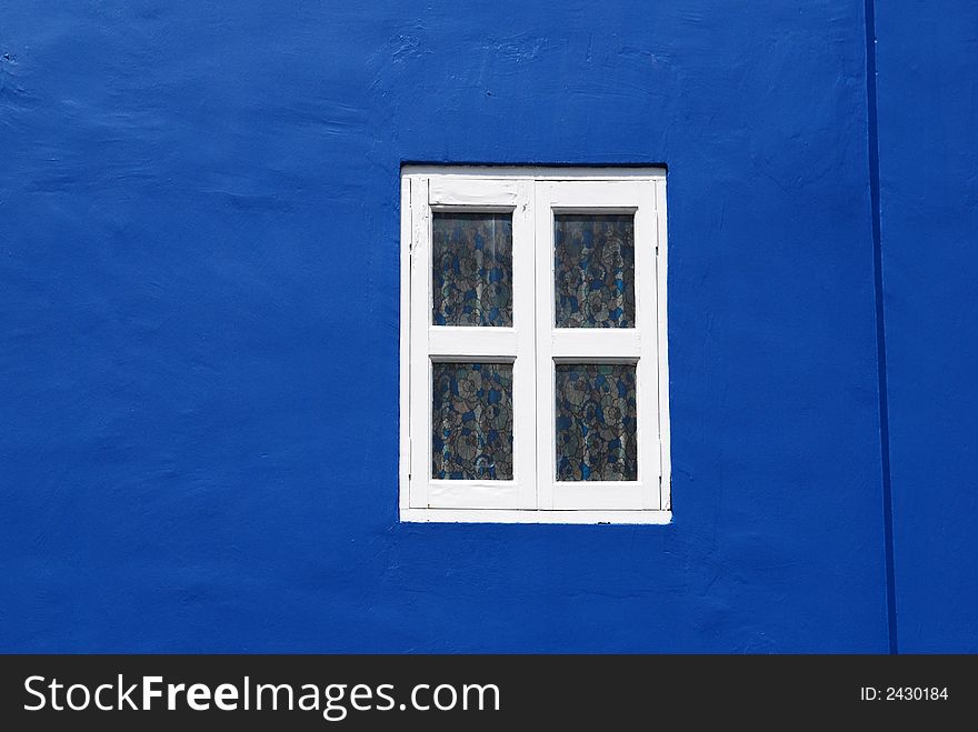 Blue walls and white windows in the city