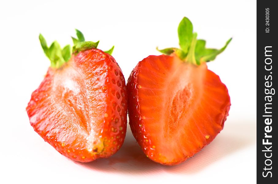 Segments of a fresh juicy ripe strawberry. Segments of a fresh juicy ripe strawberry