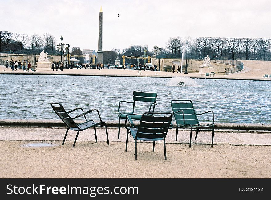 Four empty chairs in paris square