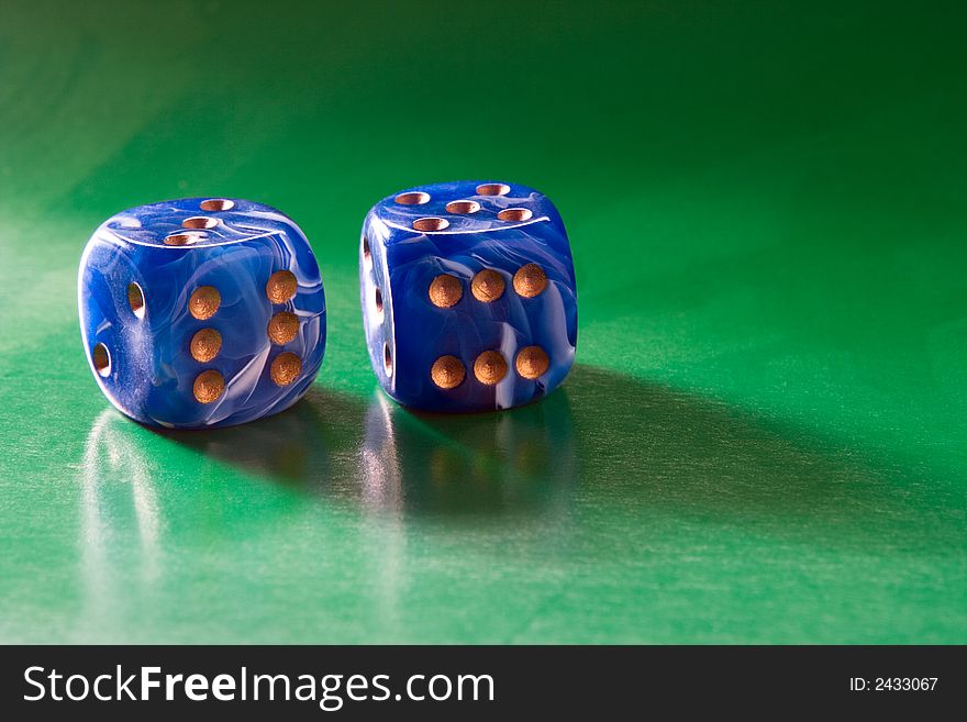 Two blue dices on green