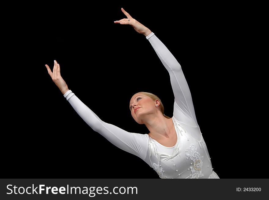 Ballerina dancing with white attire against black background