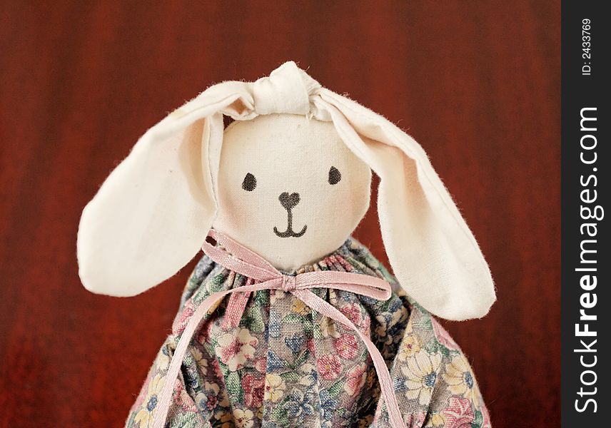 A cloth doll strikes a thoughtful, pensive pose. A cloth doll strikes a thoughtful, pensive pose