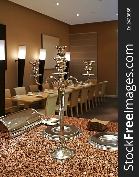 Restaurant interior with big silver candelabrum