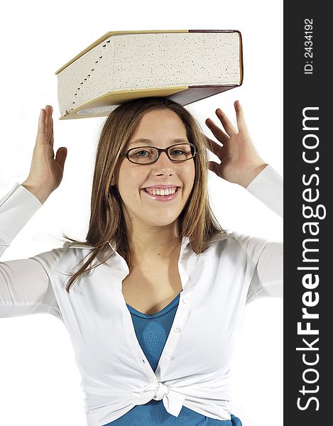 Young girl balancing a dictionary on her head. Young girl balancing a dictionary on her head