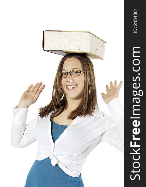 Young girl balancing a dictionary on her head. Young girl balancing a dictionary on her head