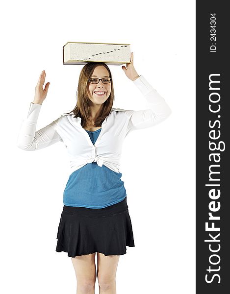 Young girl balancing a dictionary on her head. Young girl balancing a dictionary on her head