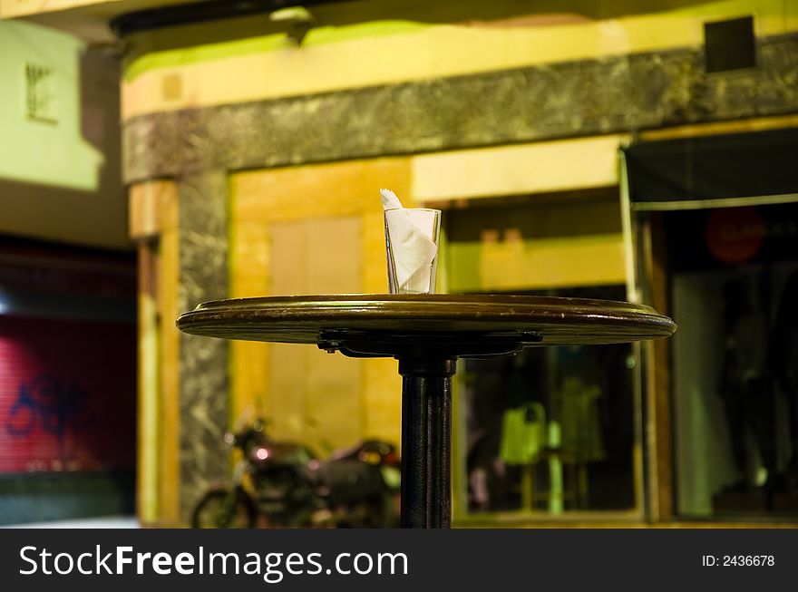 Night photo - table in sidewalk caffe in Sevilla. Night photo - table in sidewalk caffe in Sevilla