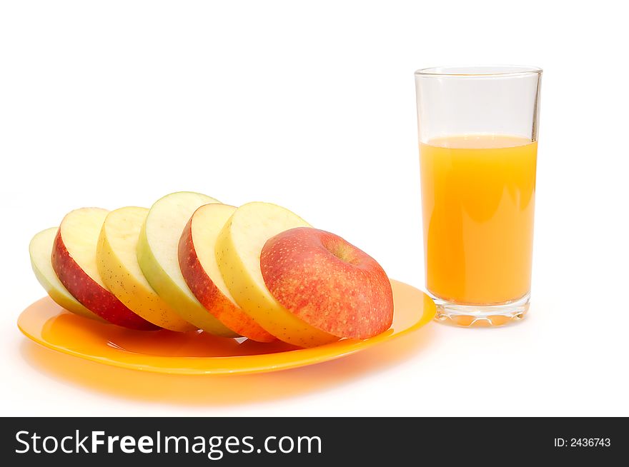 Slices of apples on a plate and juice. Slices of apples on a plate and juice