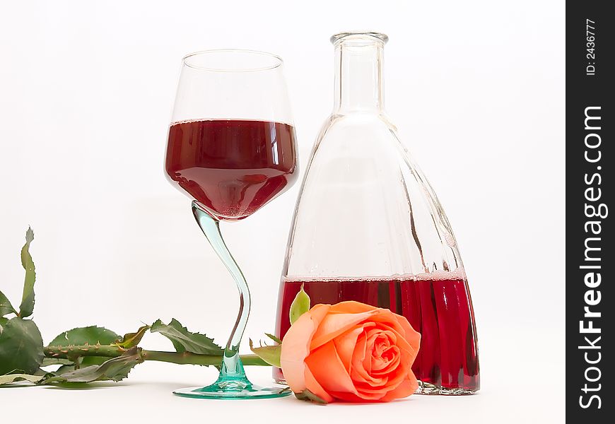 Red wine in a glass and a rose. Red wine in a glass and a rose