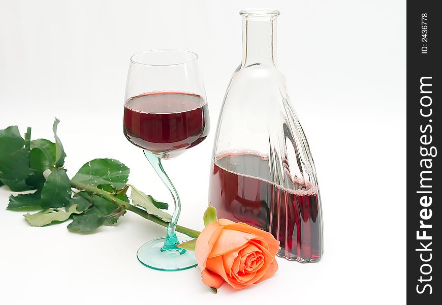 Red wine in a glass and a rose. Red wine in a glass and a rose