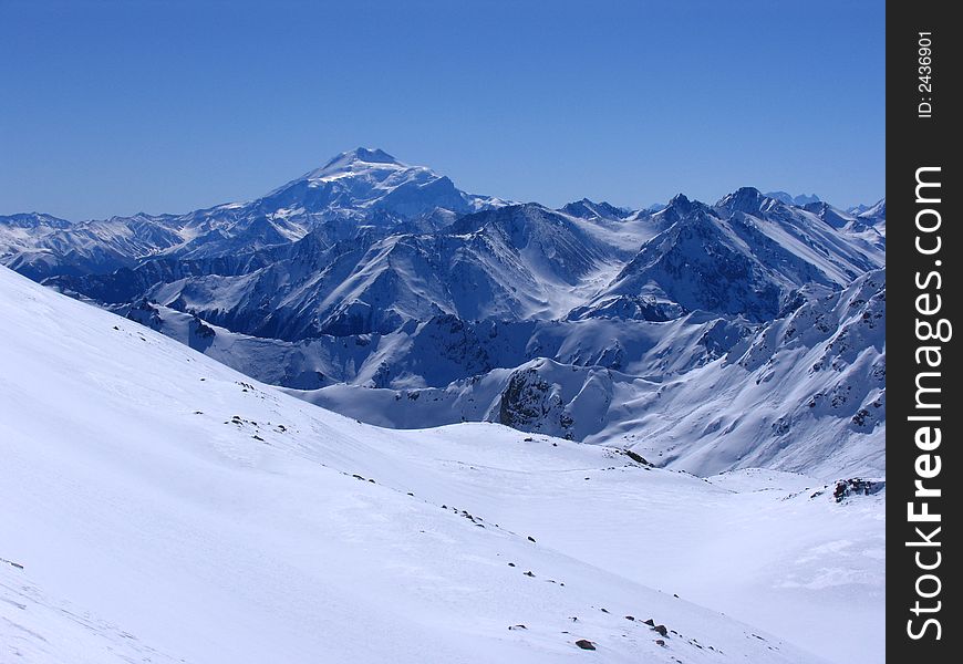 The landscape with the view of the snowed mountaines