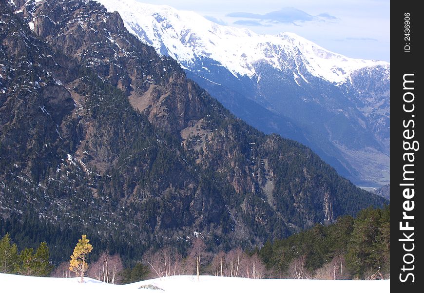 The landscape with the view of the snowed mountaines