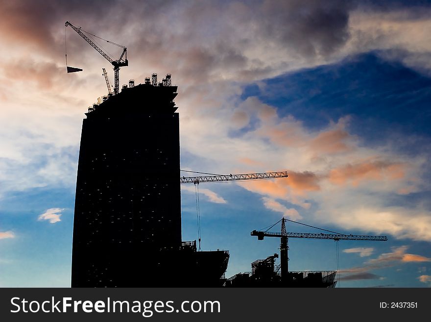 Building site in the developing business center in the evening. Building site in the developing business center in the evening