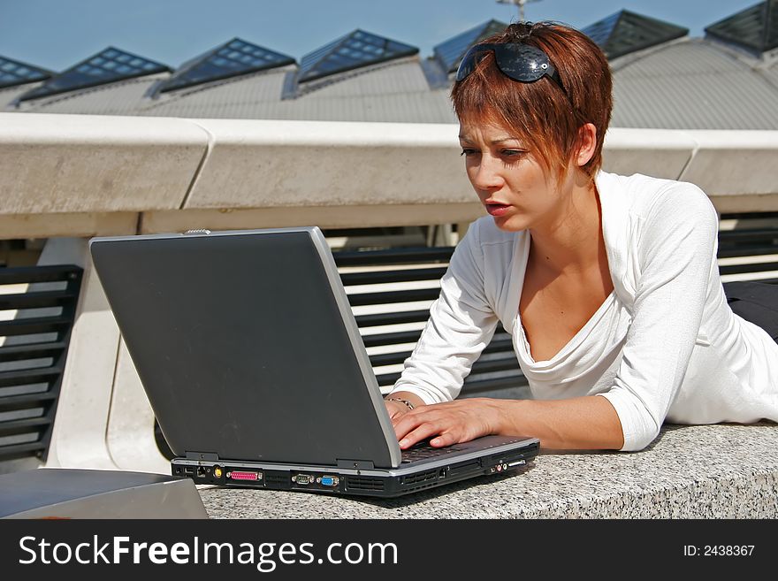 Woman working on her portable computer. Woman working on her portable computer