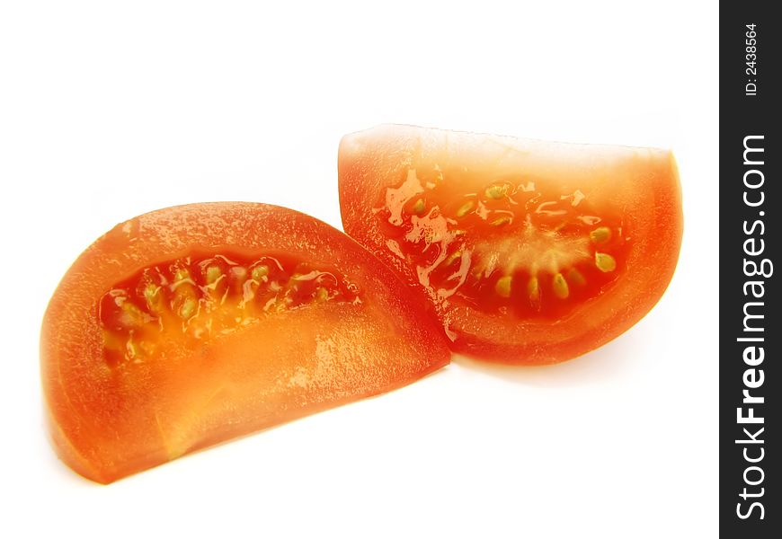 Slices of a tomato, separately, on a white background. Slices of a tomato, separately, on a white background.