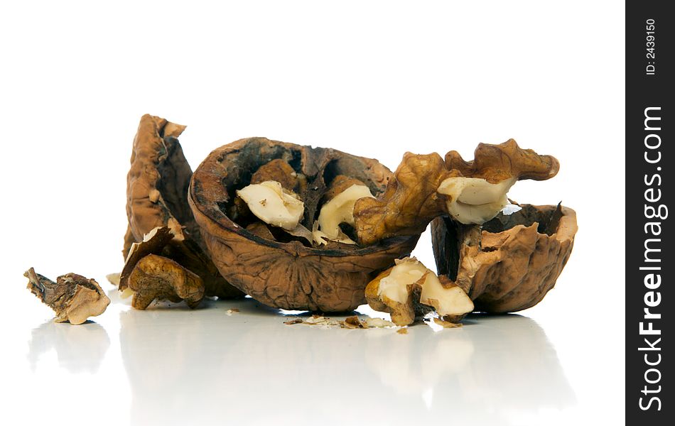 Crushed walnut over white background. Crushed walnut over white background