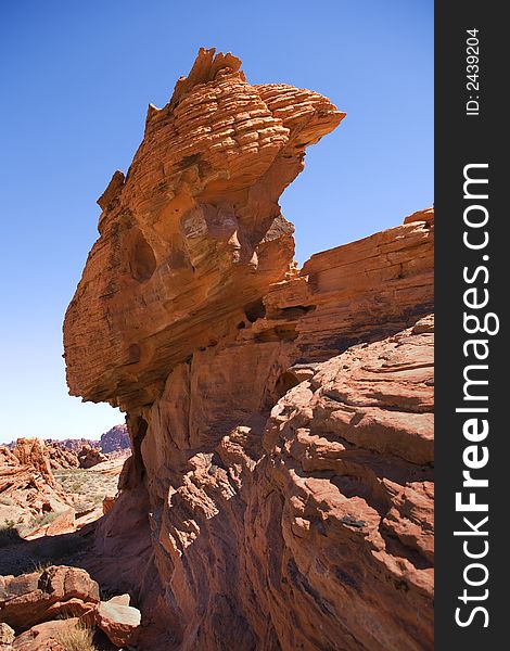 Tall eroded rock formation in desert. Tall eroded rock formation in desert