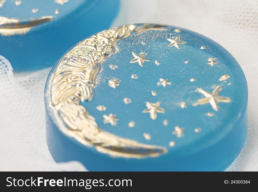 Handmade blue soap with golden moon, shallow dof. Handmade blue soap with golden moon, shallow dof.