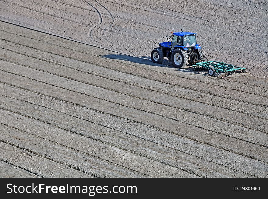 Tractor on the beach and Sunrise over the Black Sea at Mamaia resort near Constanta city in Romania. Tractor on the beach and Sunrise over the Black Sea at Mamaia resort near Constanta city in Romania