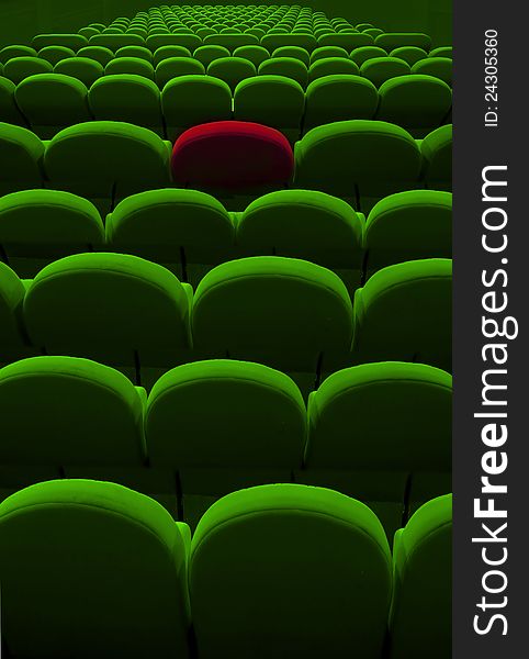 Green cinema or theater empty seats with red one. Green cinema or theater empty seats with red one