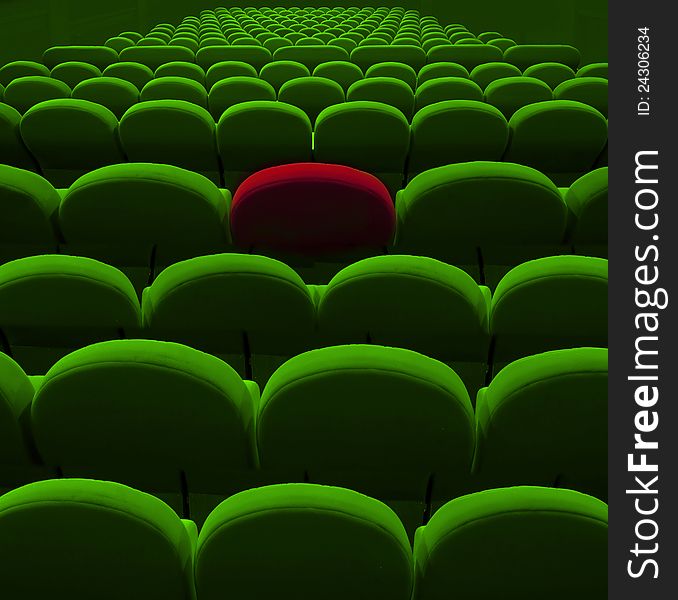 Green cinema or theater empty seats with red one. Green cinema or theater empty seats with red one