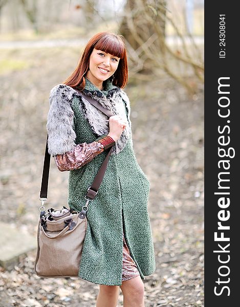 Portrait of the young beautiful smiling woman outdoors. Portrait of the young beautiful smiling woman outdoors