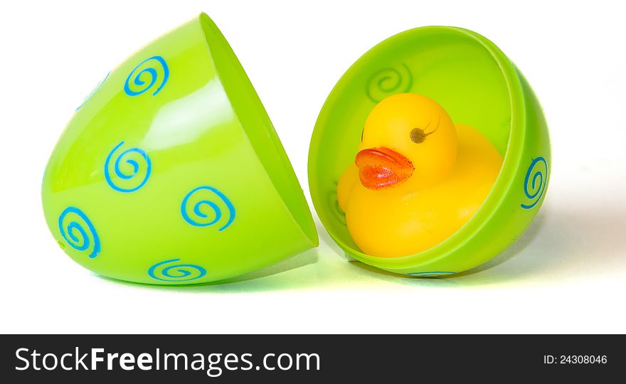 Rubber duck inside green Easter egg. Rubber duck inside green Easter egg