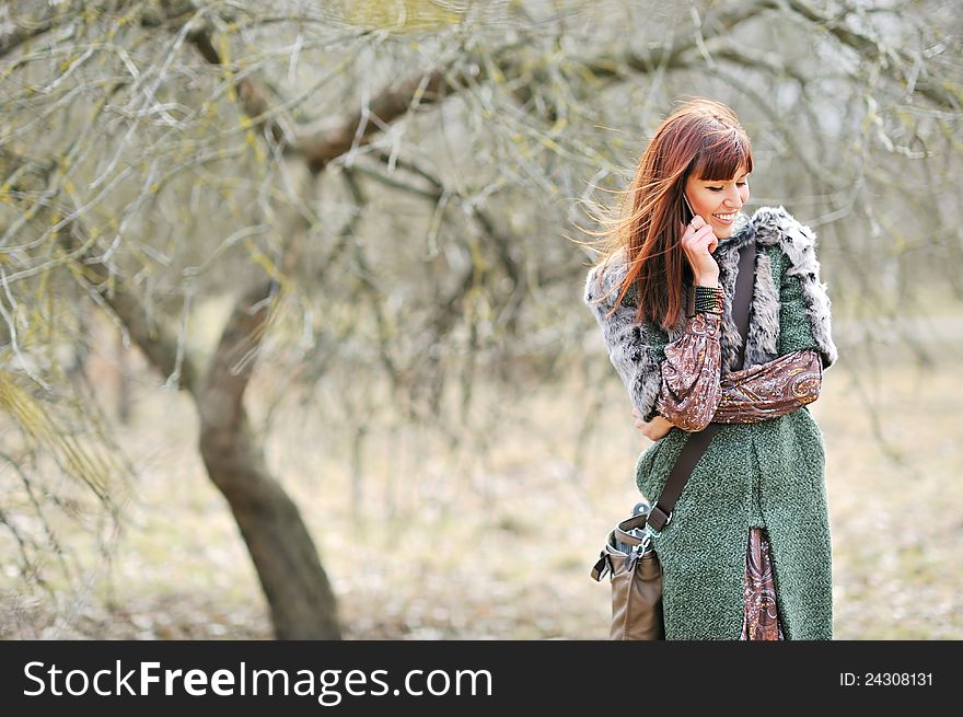 Portrait of attractive young woman talking on the mobile phone