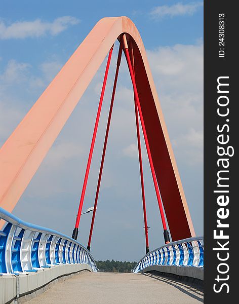 Bridge with blue balustrade at sky